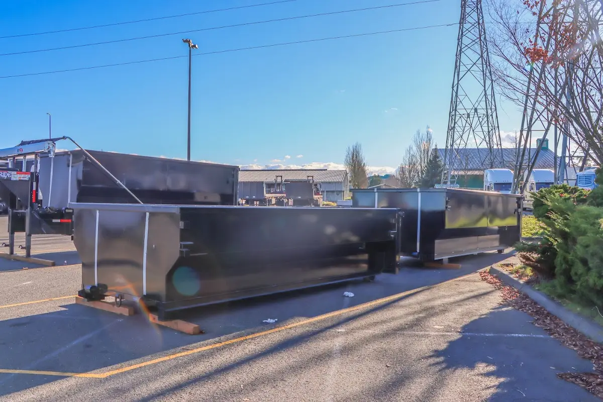Roll-off dumpster ready for waste disposal at job site for 2 Yard Dumpster Rental in Dexter